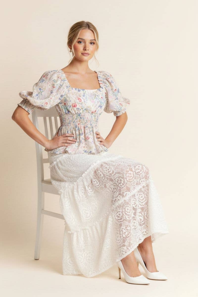 A New Arrival              FLORAL PRINT PEPLUM TOP