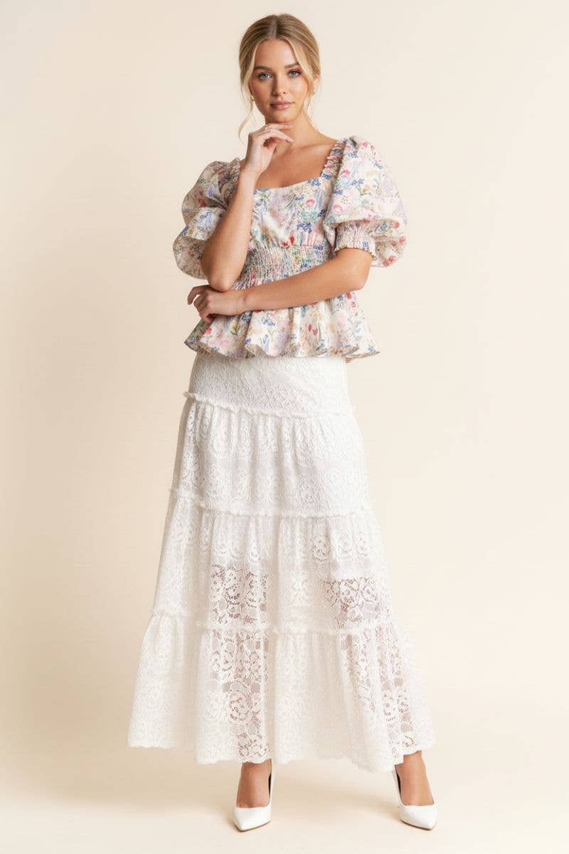 A New Arrival              FLORAL PRINT PEPLUM TOP