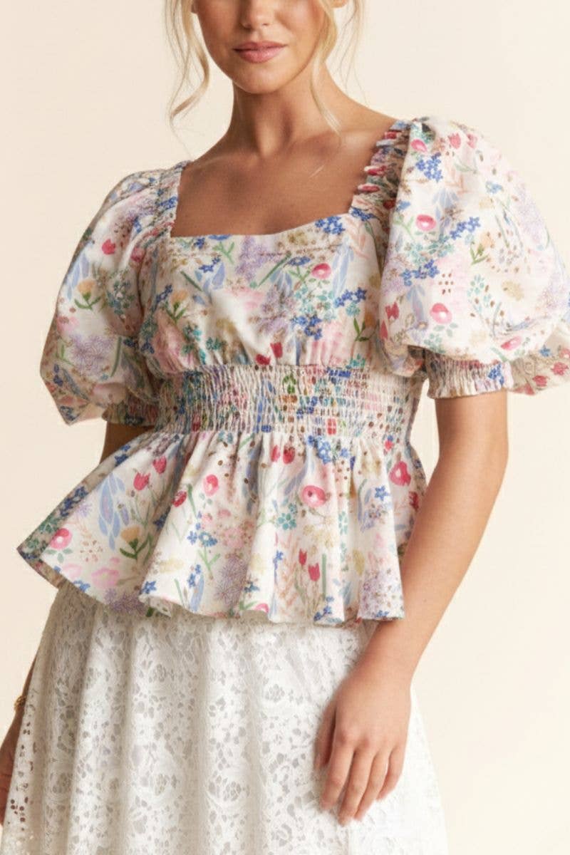 A New Arrival              FLORAL PRINT PEPLUM TOP