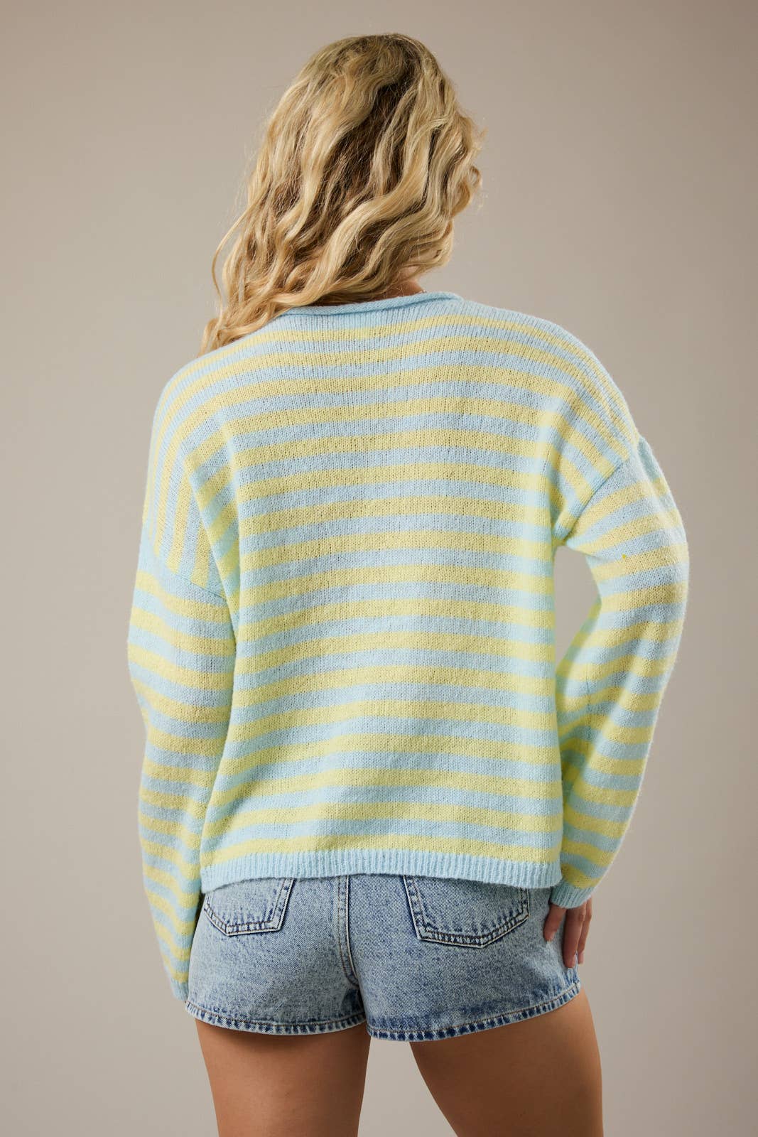 A New Arrival                 LONG SLEEVE ROLLED HEMLINE DETAIL STRIPE HALF BUTTON SWEATER: BLUE-YELLOW STRIPE