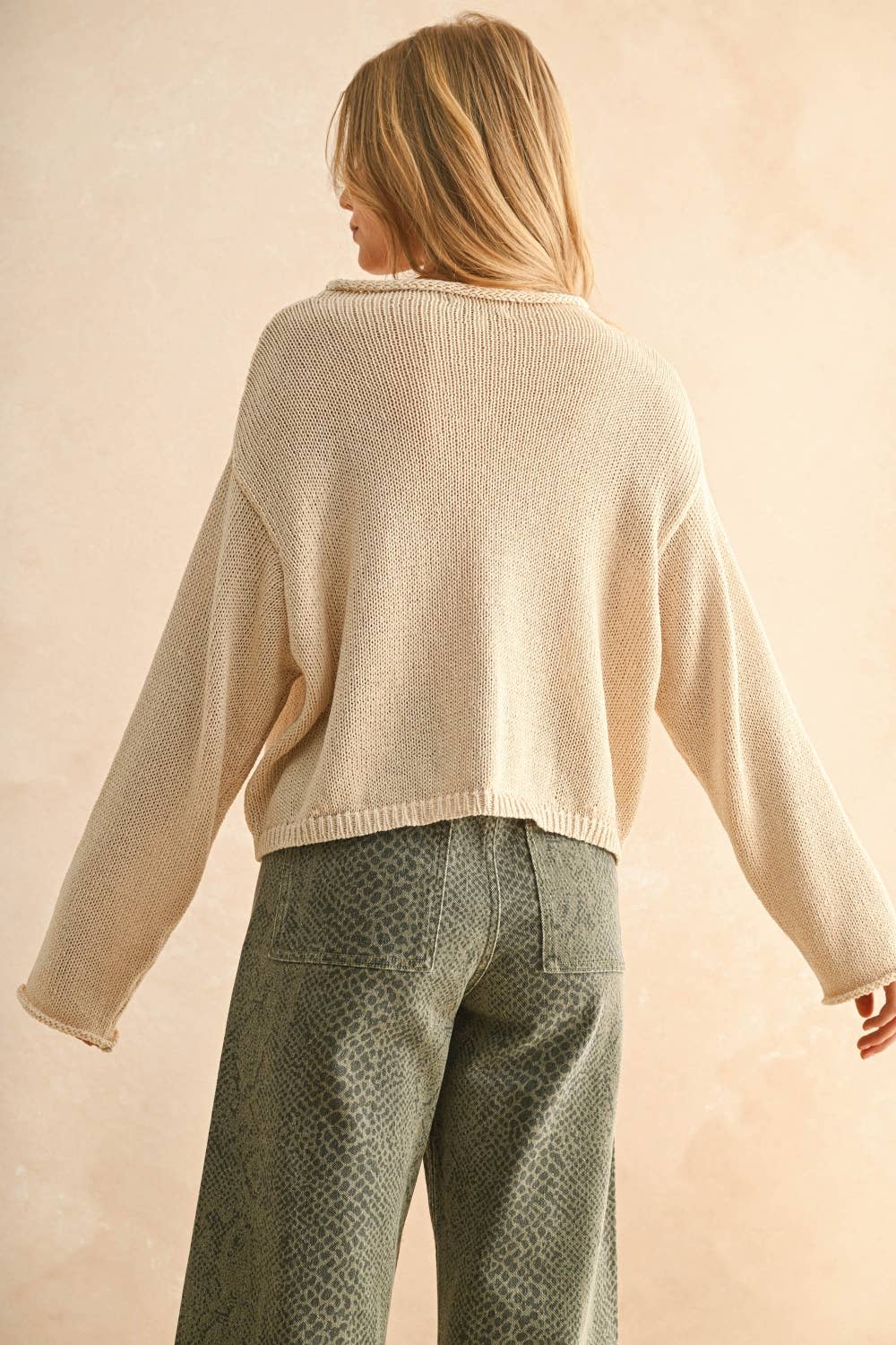 A New Arrival                LIGHT WEIGHT BUTTON FRONT CARDIGAN: CREAM